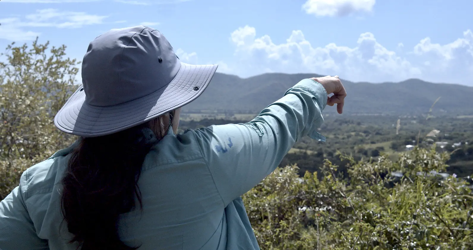 Isabel Rivera-Collazo points to horizon