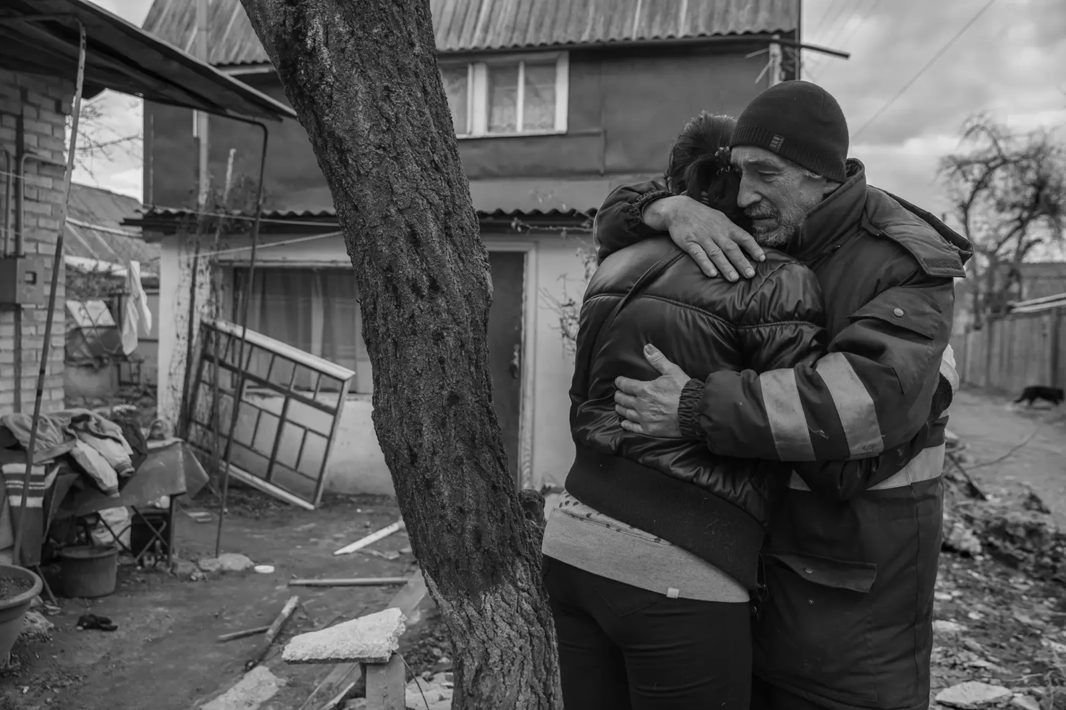 A grieving Iryna Havryliuk receives an embrace.