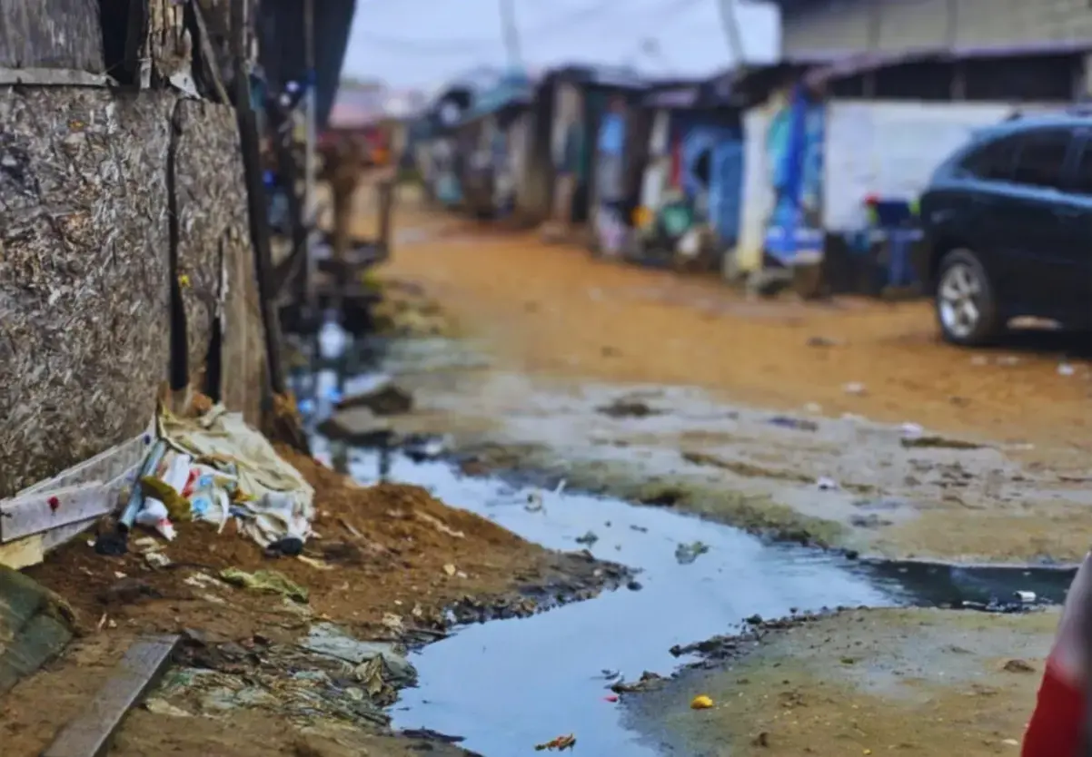 Shallow gutters erected beside wooden houses within residential areas in Lagos, Nigeria, 2023.