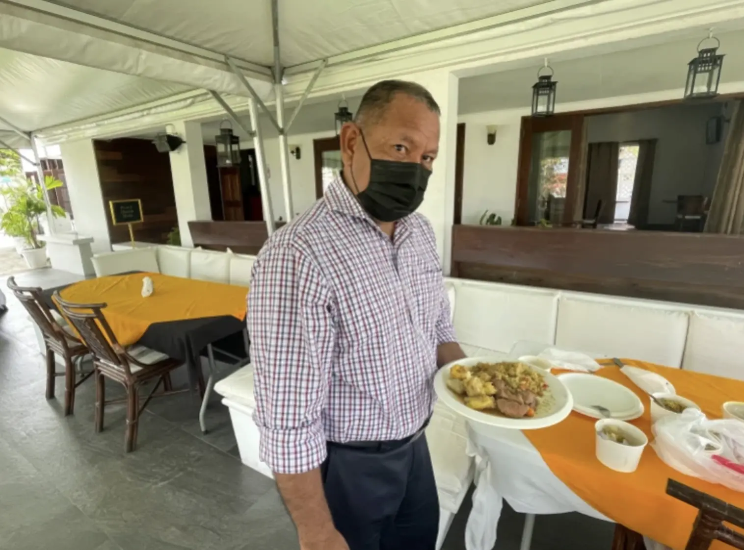 A man shows off plate of food