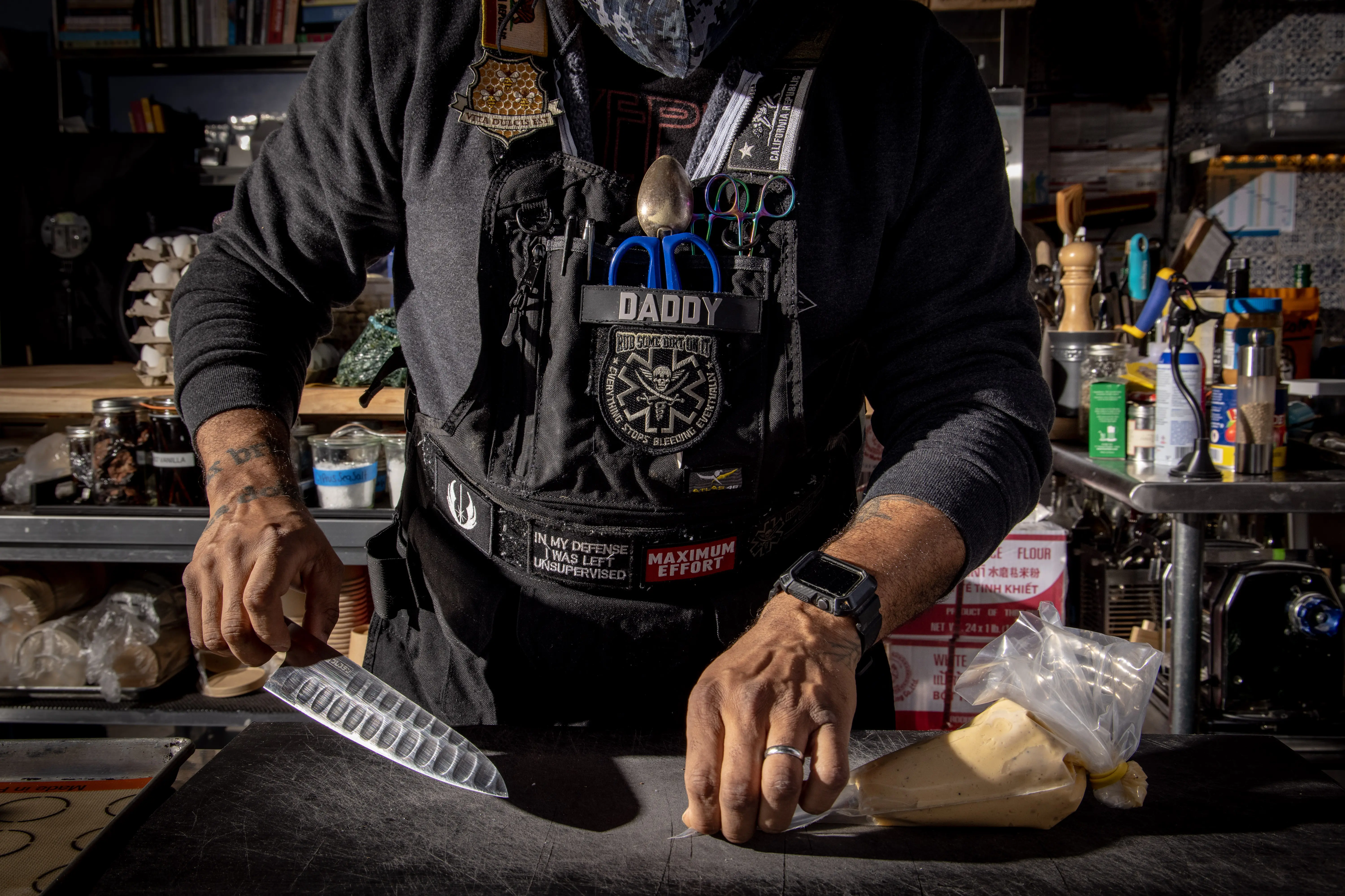 Chef holds a knife in the kitchen