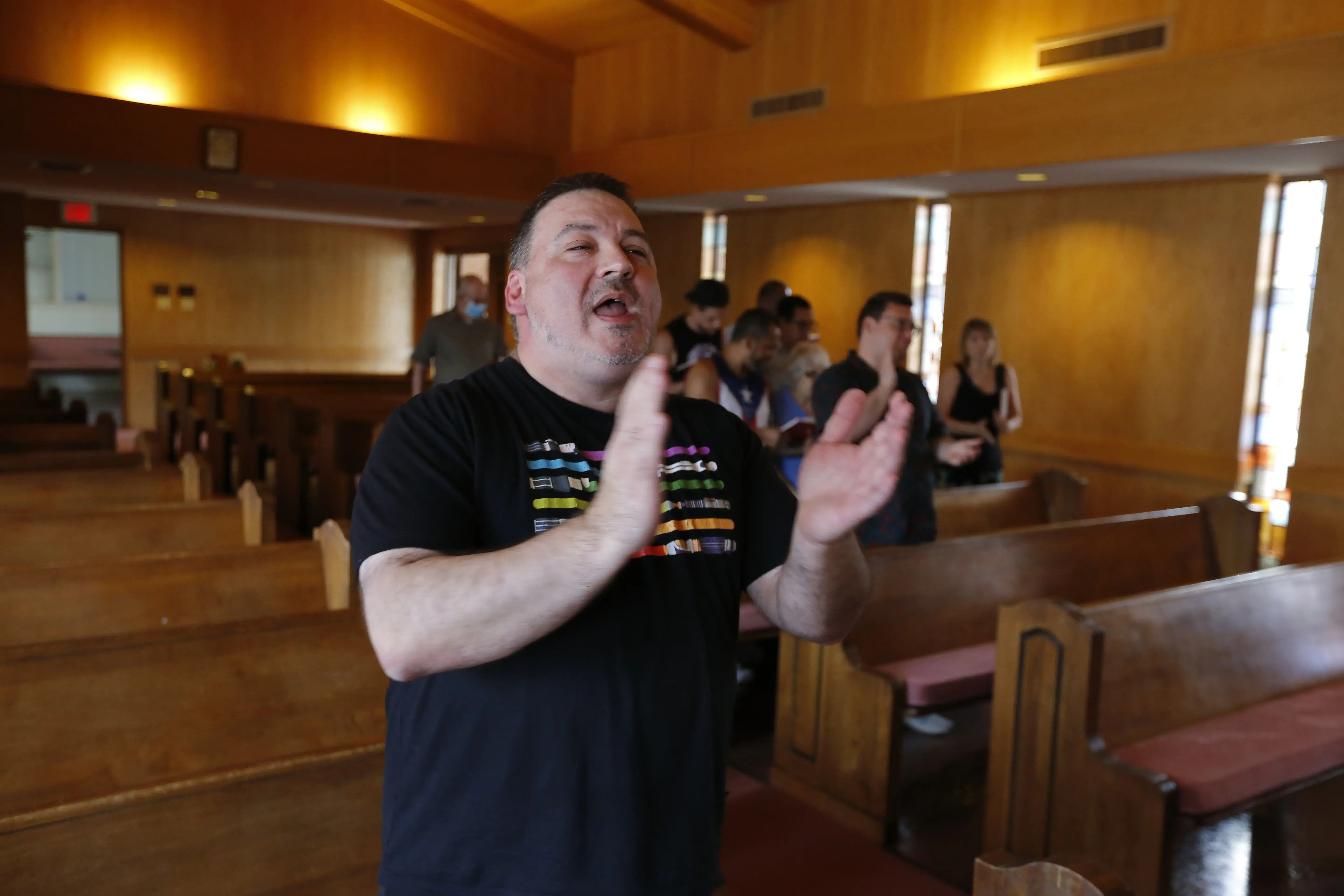 A pastor sings in church