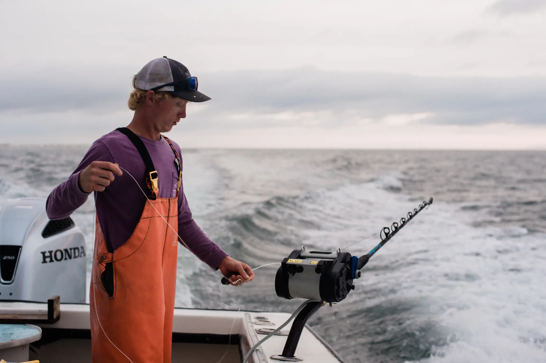 A guy in a boat fishing