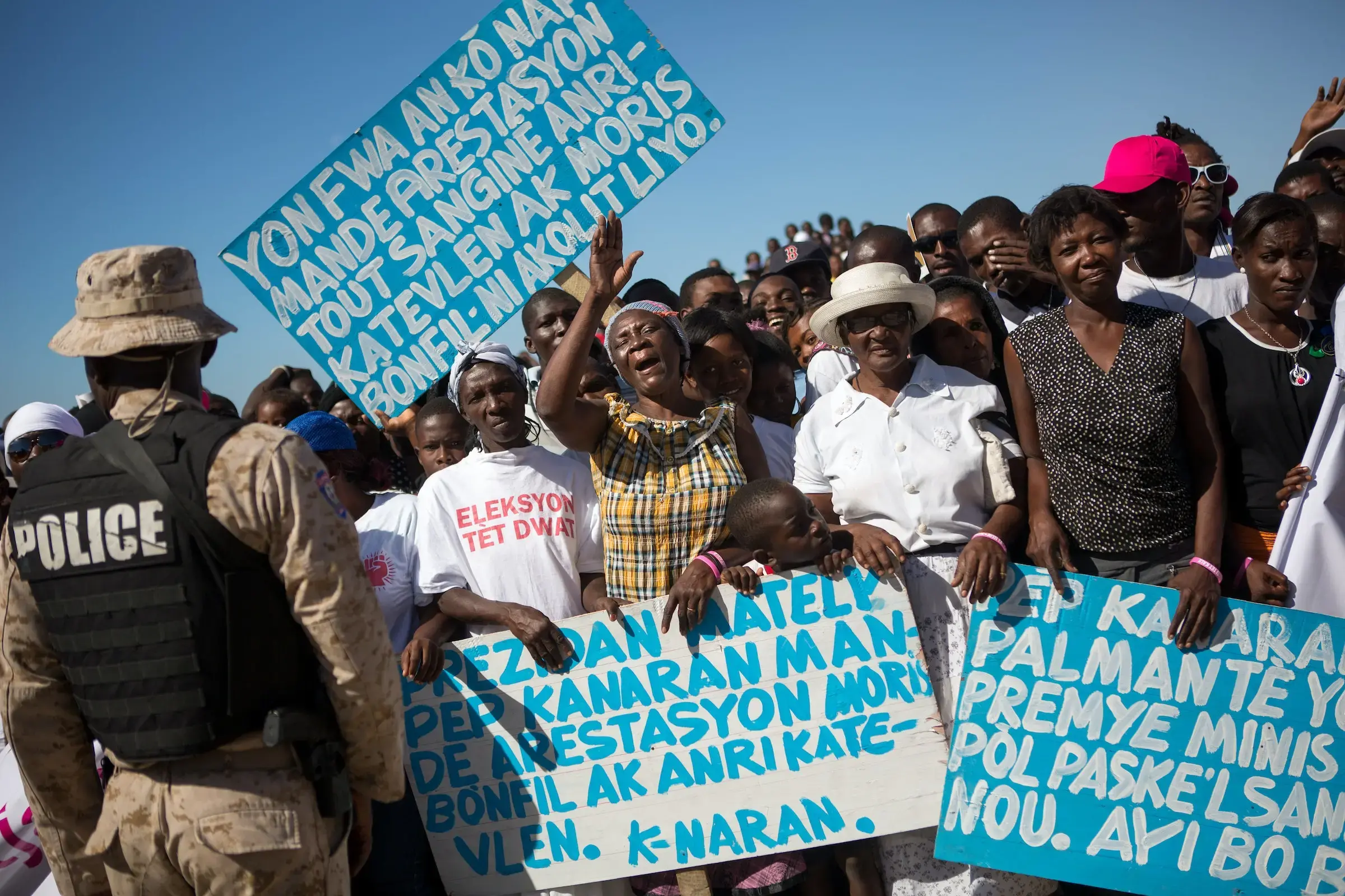 protestors holding signs