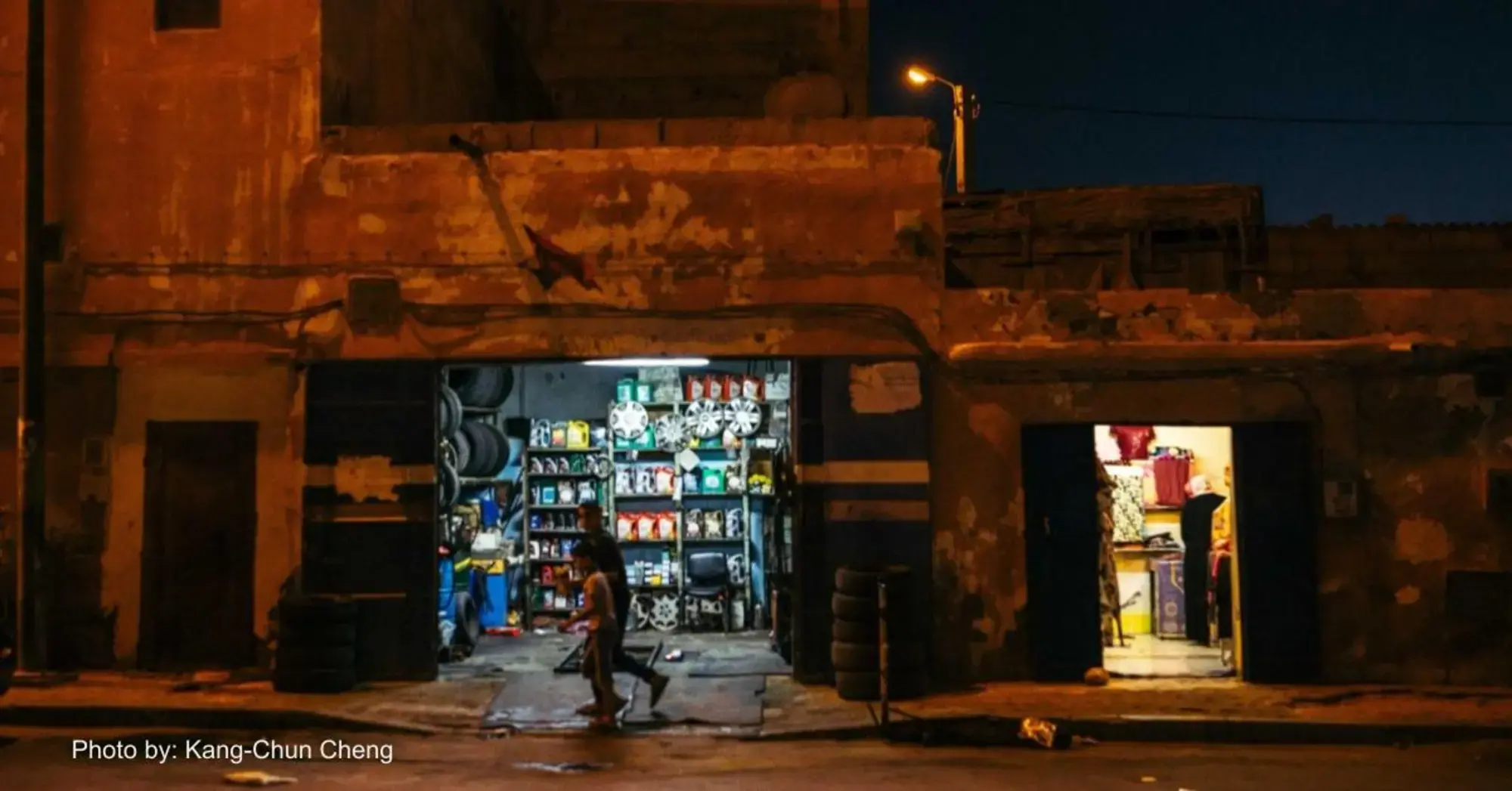 A convenience store at night in Western Sahara