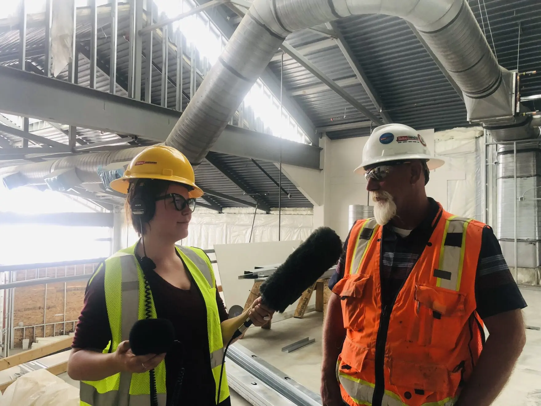 Reporter Taylar Stagner interviews a worker at the Fort Peck Wellness Center in Montana.