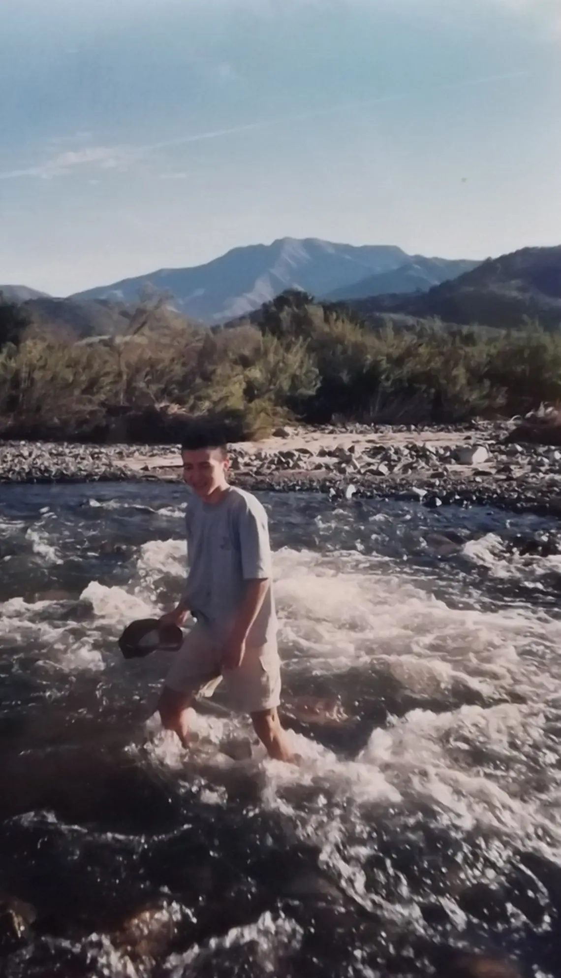 Man stands in a flowing river