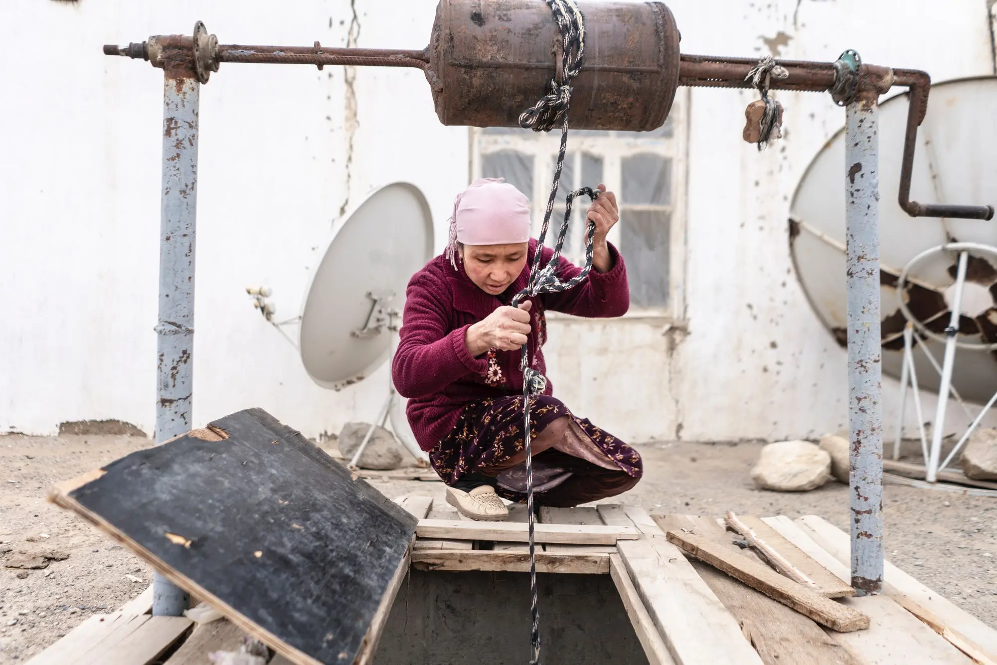 A woman pulls rope