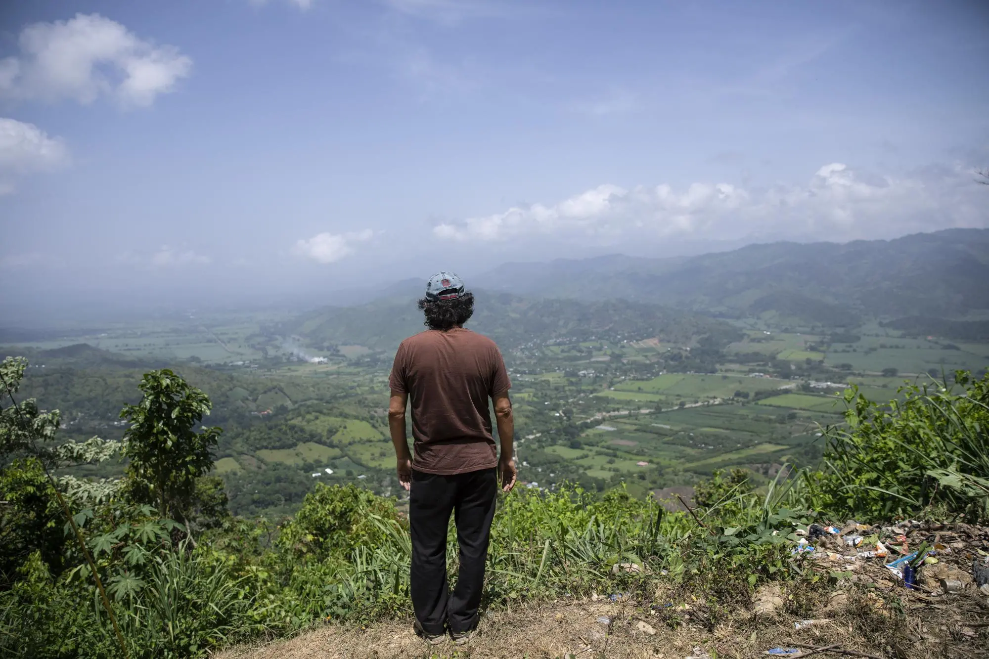 Man looks at out at town in Honduras