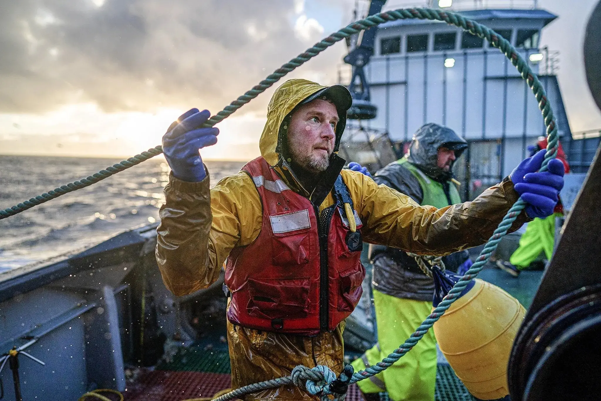 Rain gear in a fishing boat in the main working harbor of