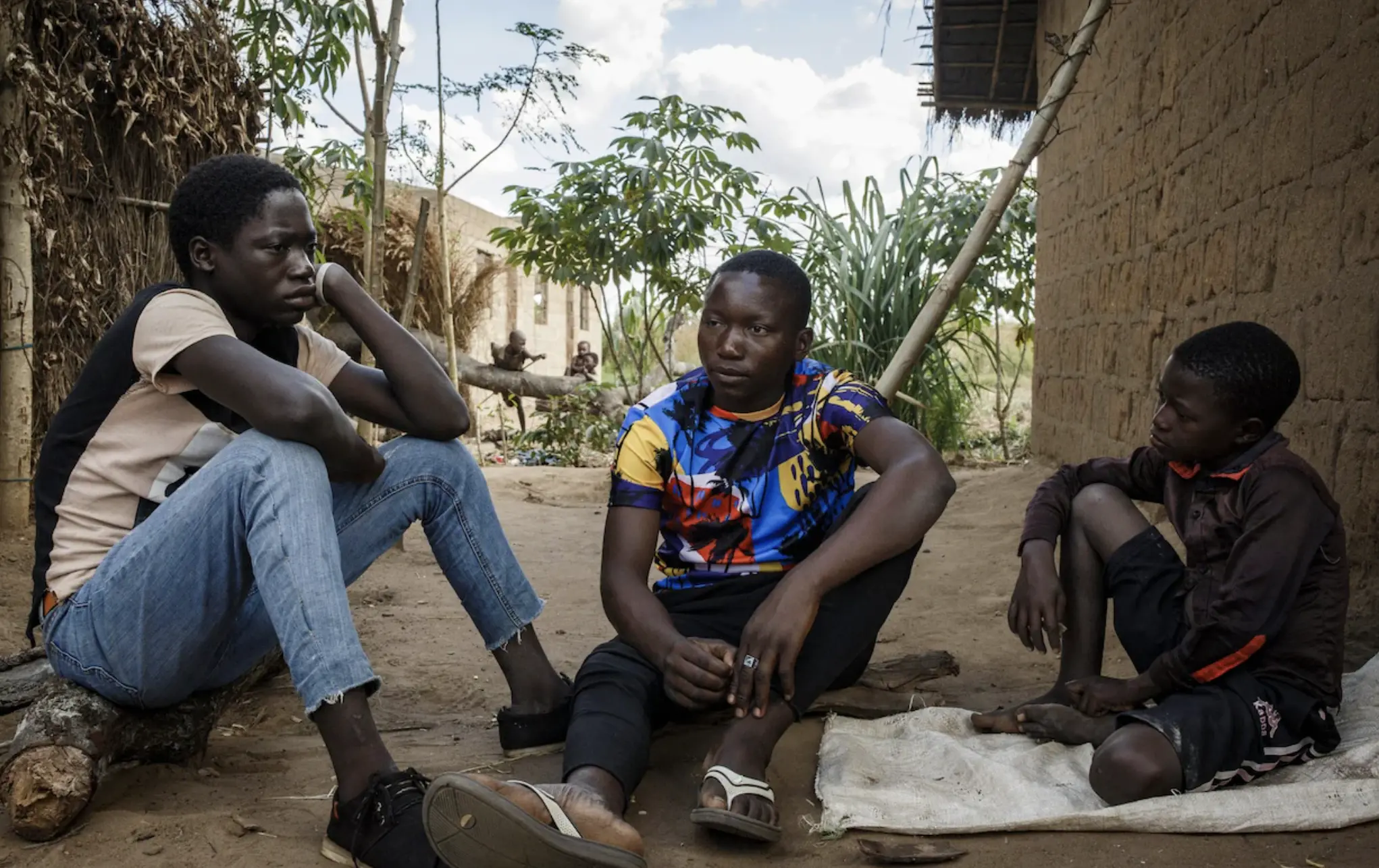 Three boys sit together