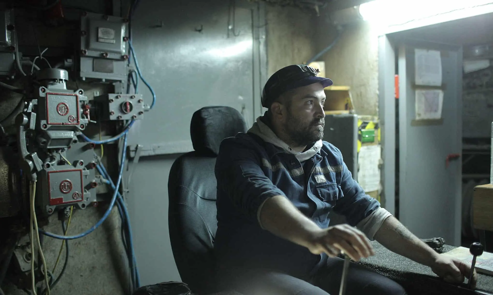 Sebastian Tirintică operating machinery inside the mine
