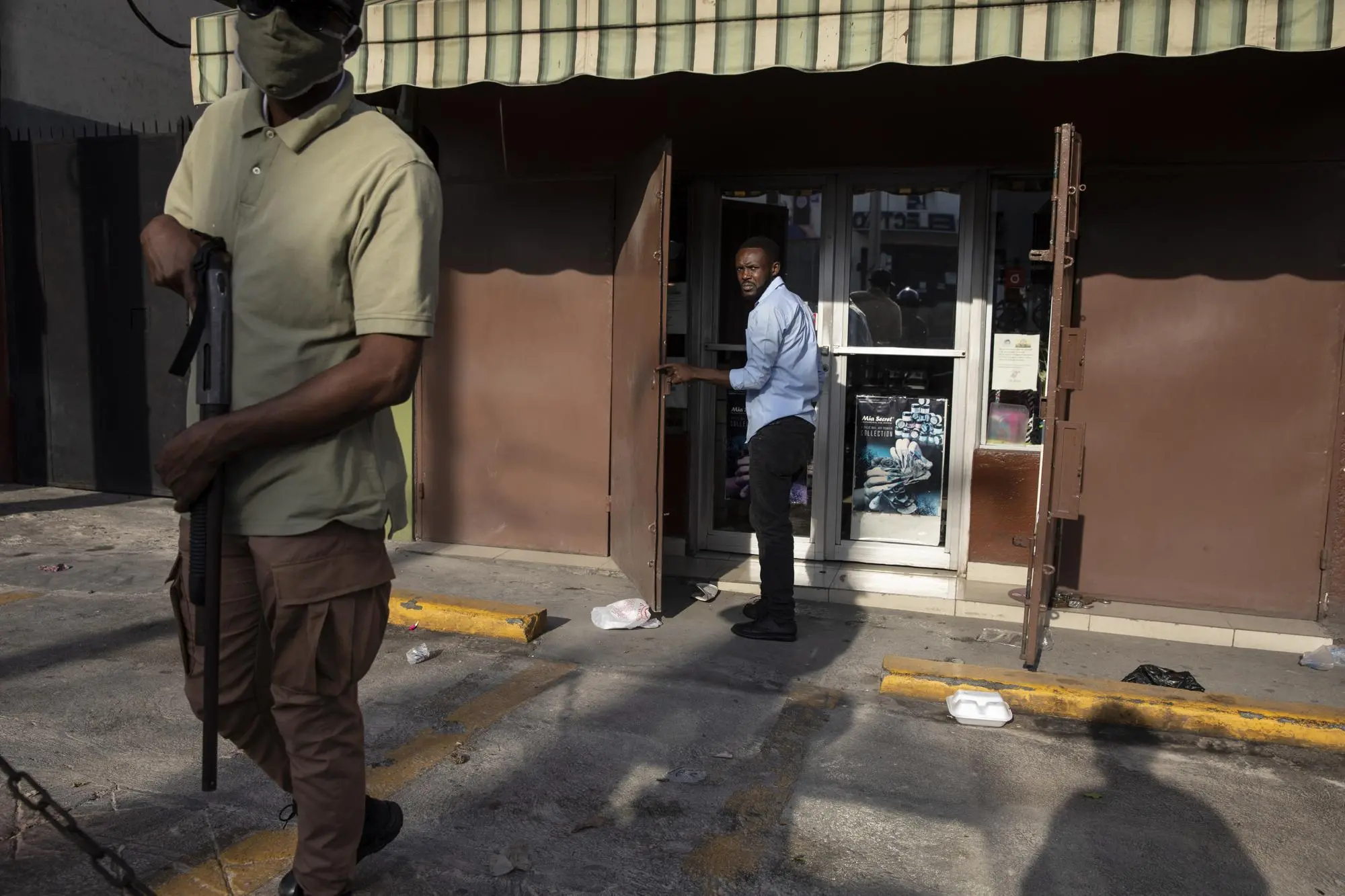 Personal security guard a shop in Haiti