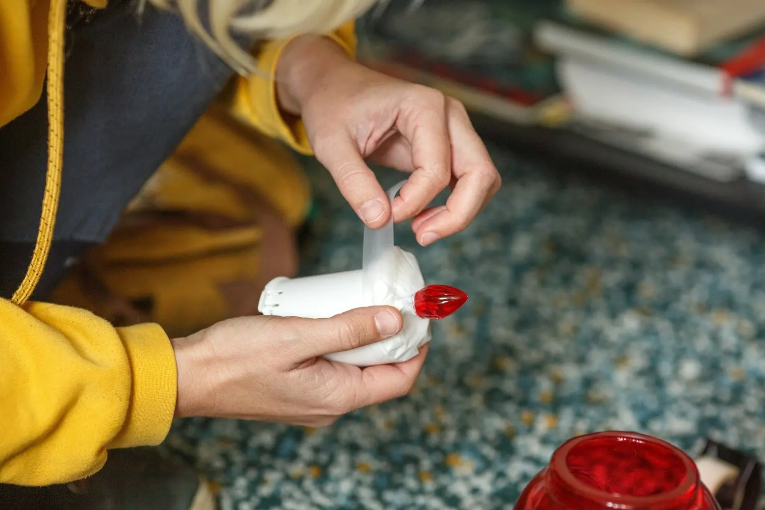 A device being attached to a candle