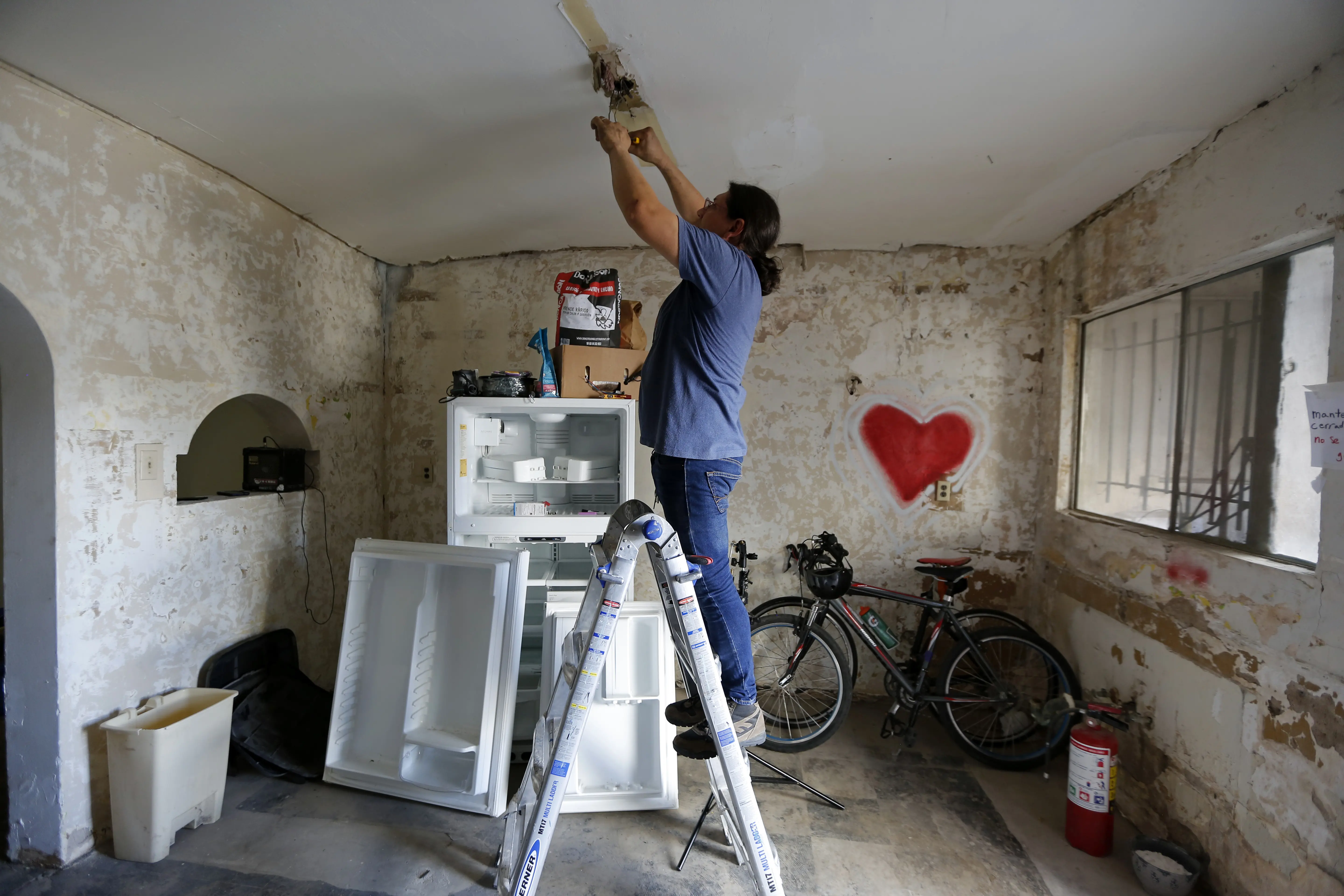 Susana does electrical work using a ladder