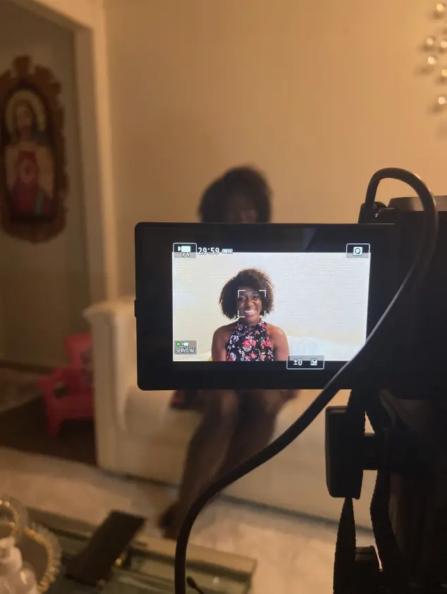 Woman getting filmed for documentary