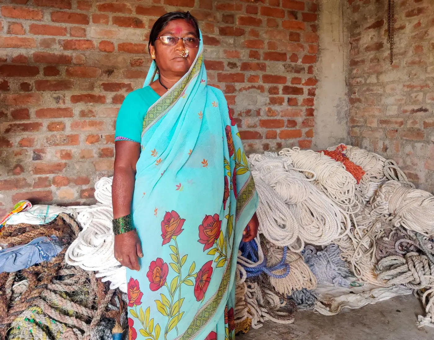 Woman stands in front of ropes