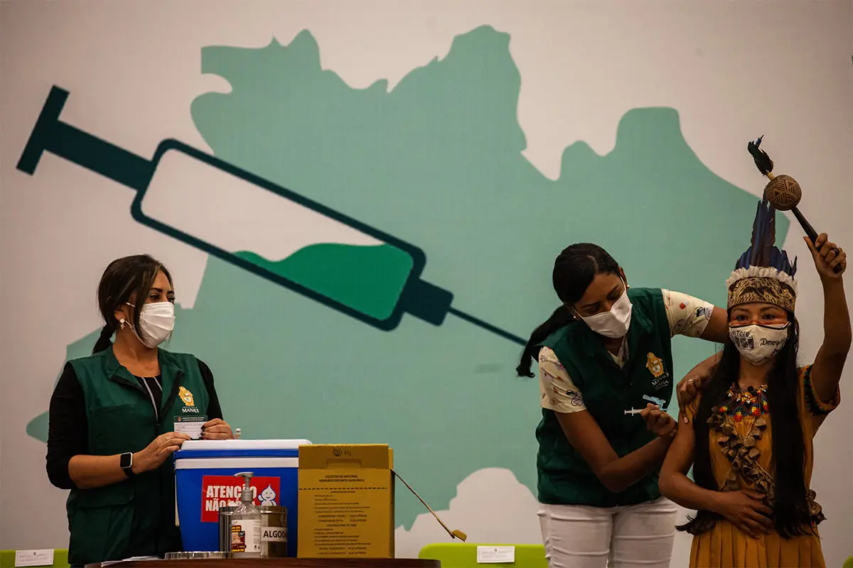 Indigenous woman receiving the vaccine