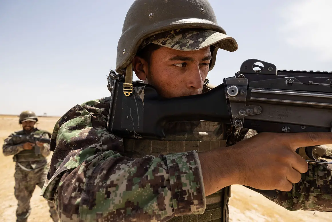 a solider points a gun