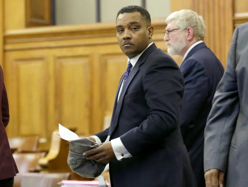 A man looks back in courtroom