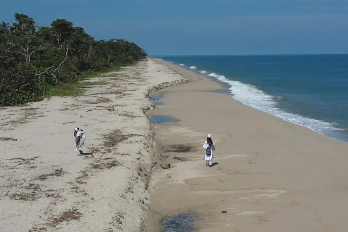 Indigenous walk on a beach
