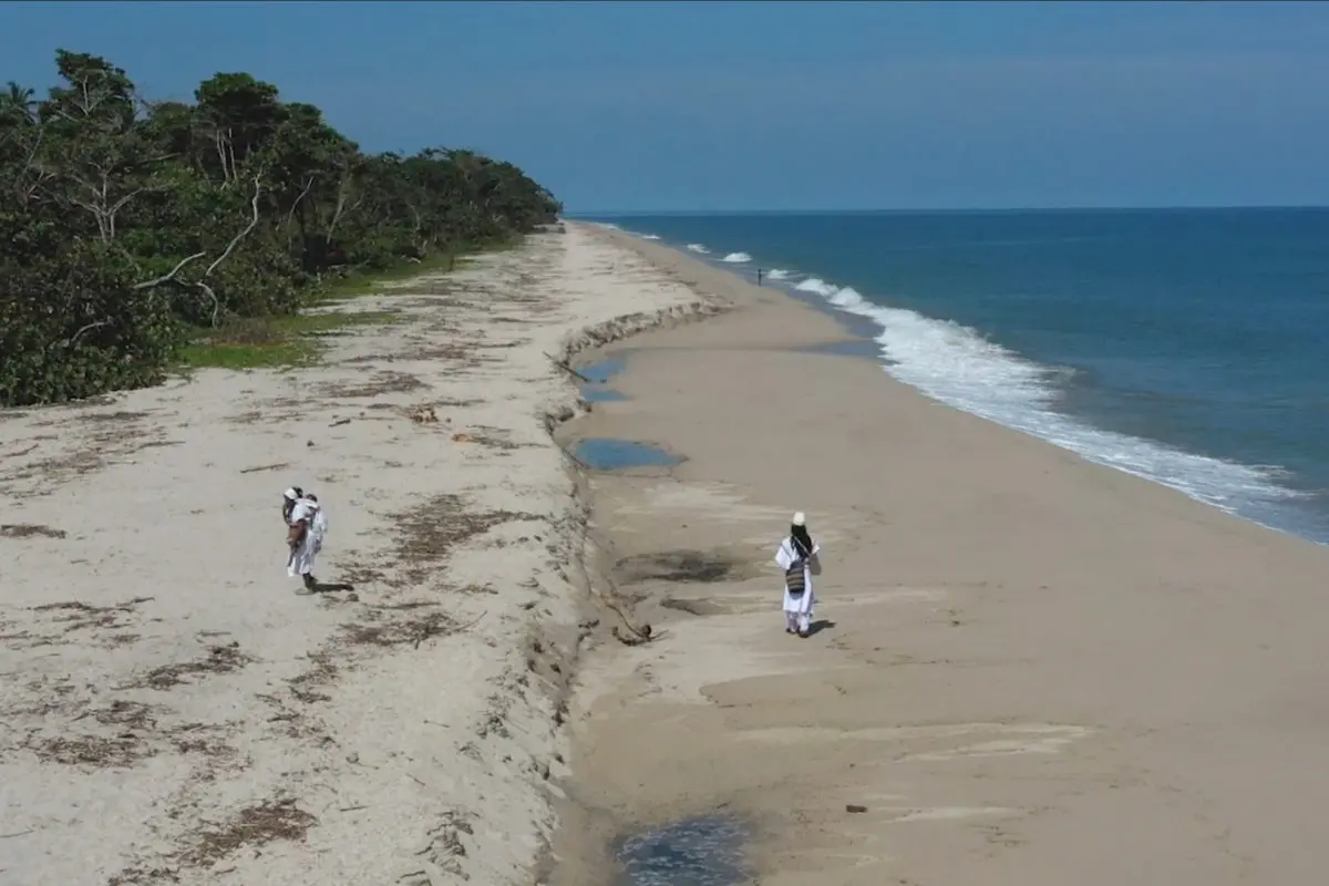 Indigenous walk on a beach 