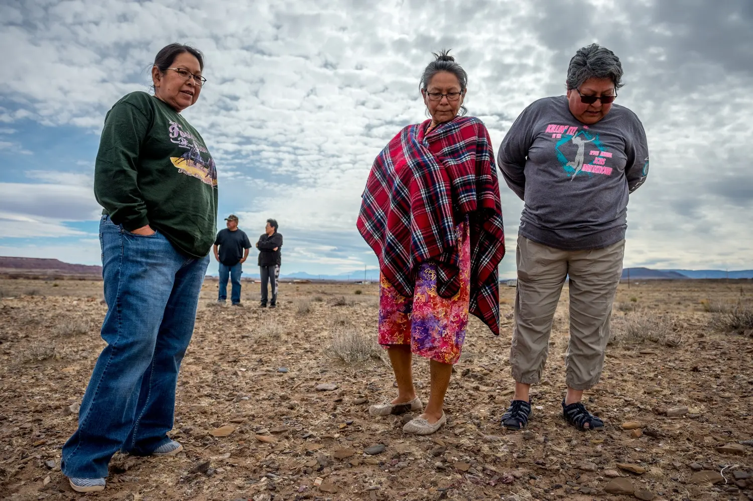 Sisters Linda Talker, Carol Talker and Leona Begishie walk near their family home in Cameron, Ariz. Image by Mary F. Calvert. United States, 2020.