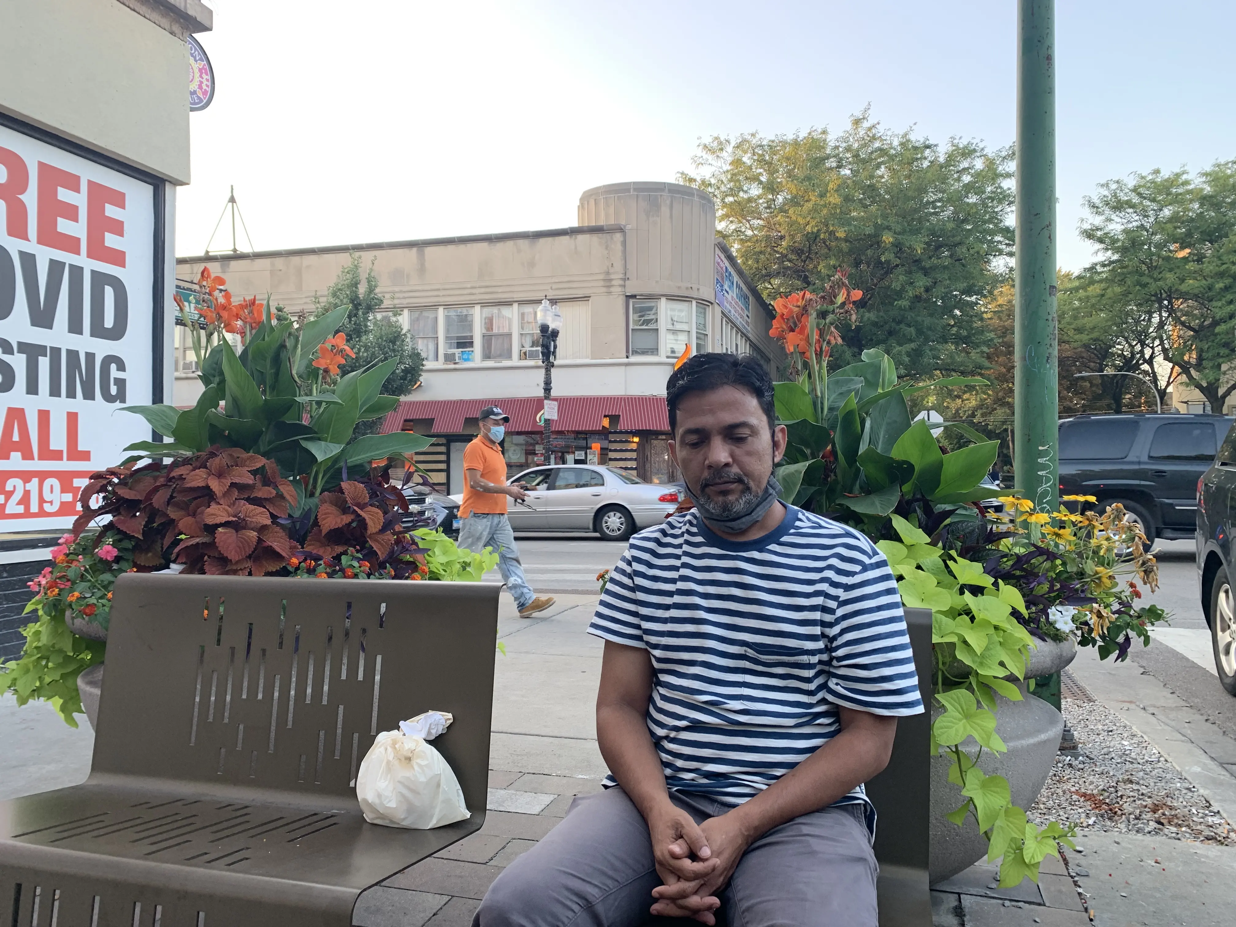 Nur Amin Rahman seated on bench in Chicago