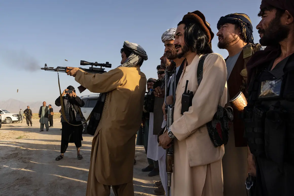 A man stands in front of group of men with a gun