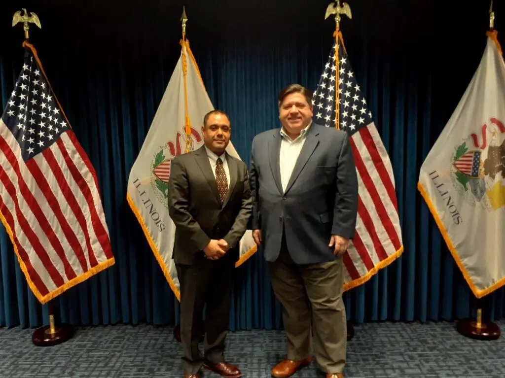 Miguel Perez Jr. (left) and Gov. Pritzker (right)