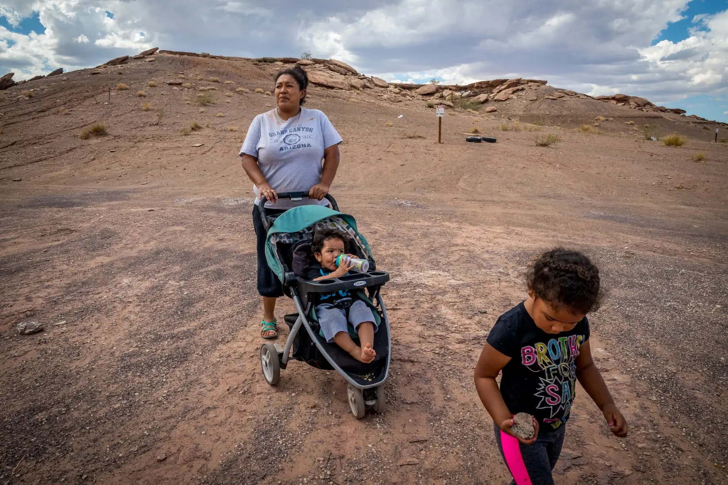 Samantha Beard and her children Merrick, 2, and Zoe, 4, walk outside their home in Cameron. Image by Mary F. Calvert. United States, 2020.