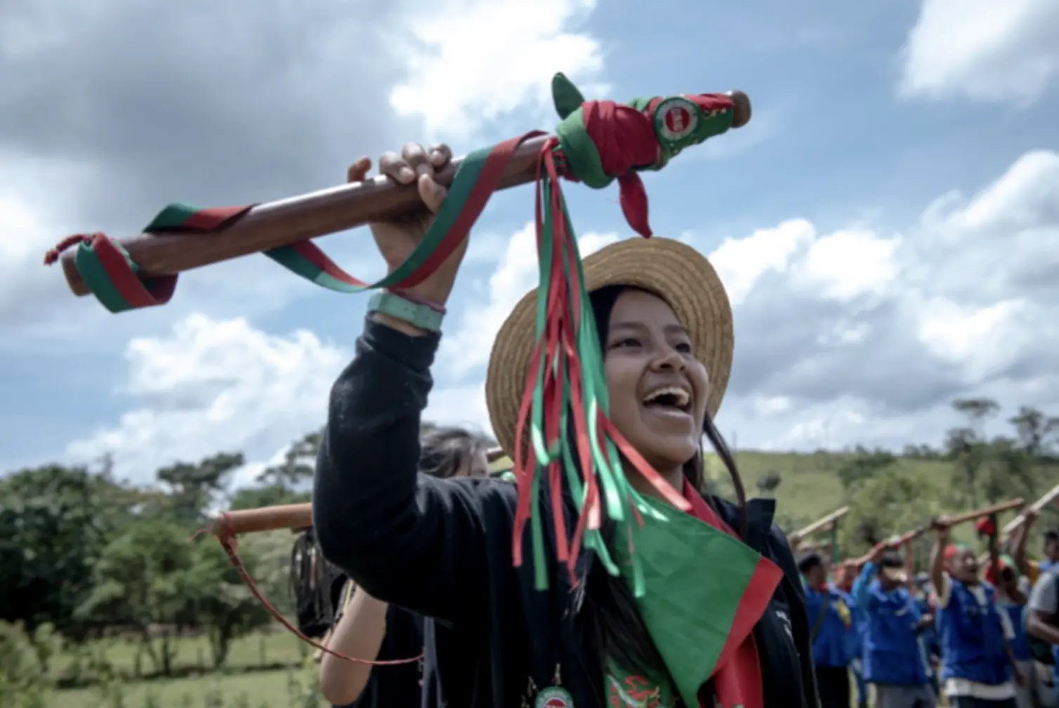 A young girl holds a baton