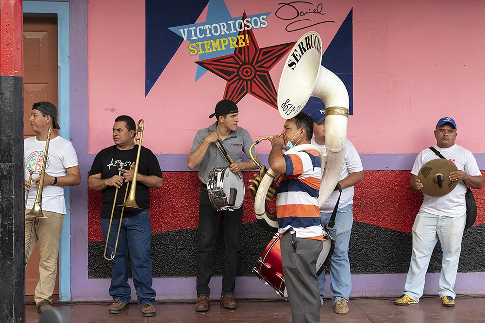 A group of band members line up in town