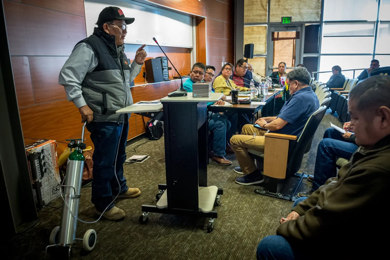 Leslie Begay, 65, is pictured attending a uranium public hearing sponsored by the Navajo Nation Council at Diné College in Shiprock, N.M. Image by Mary F. Calvert. United States, 2020.