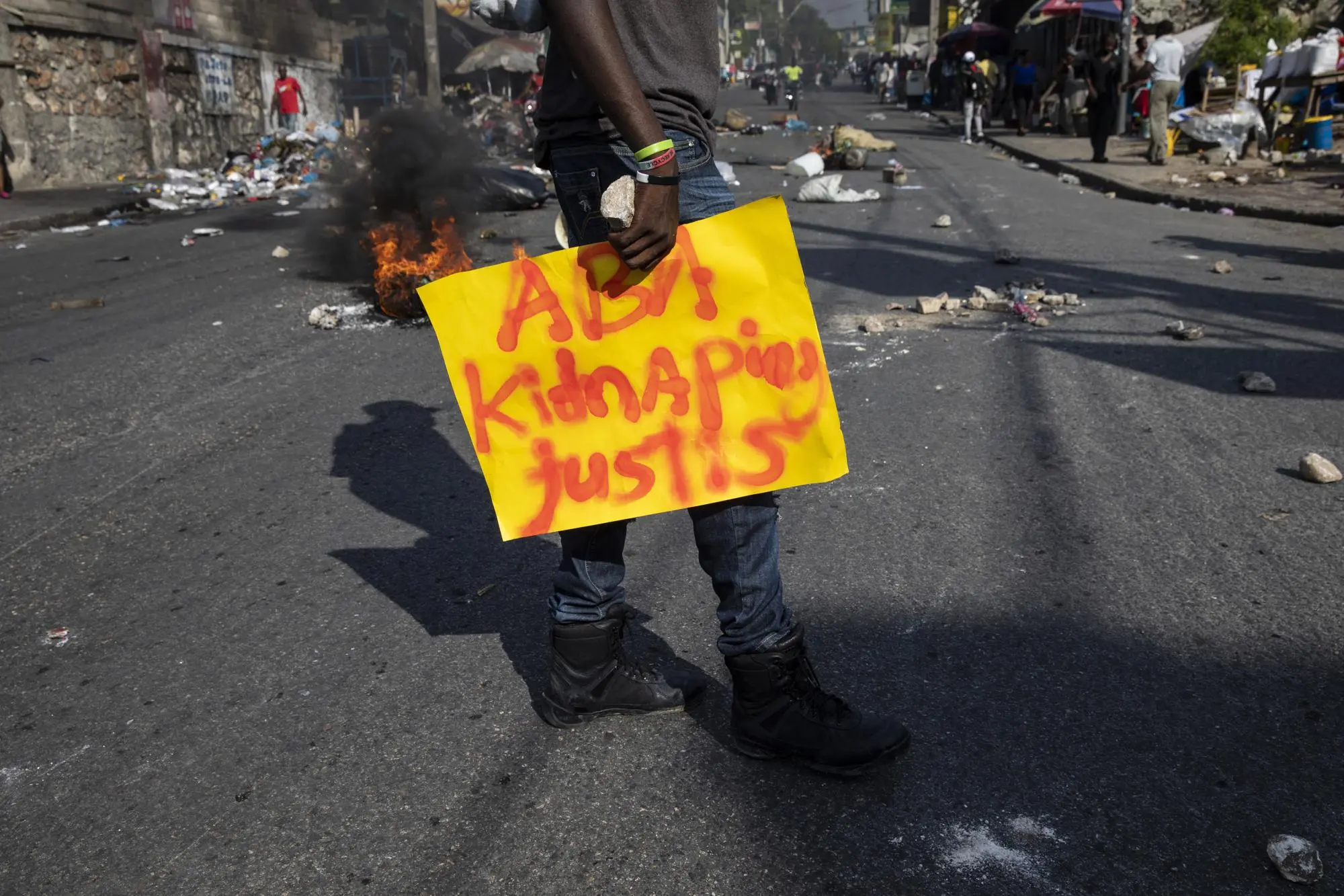 A protestor carries a sign