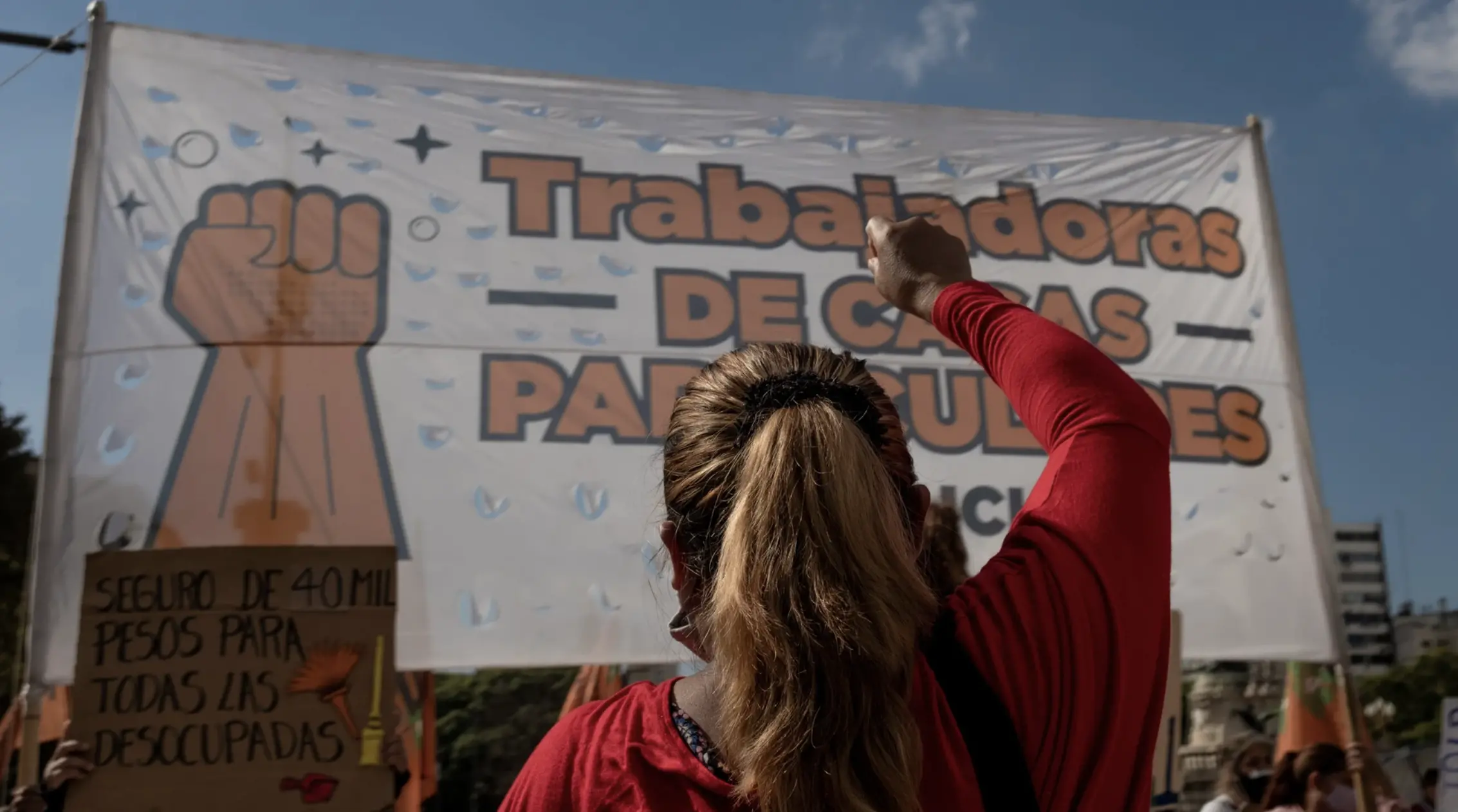 Women holding fist at protest