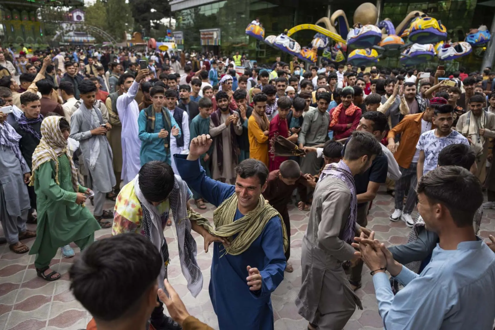 Afghans dance in an amusement park in Kabul
