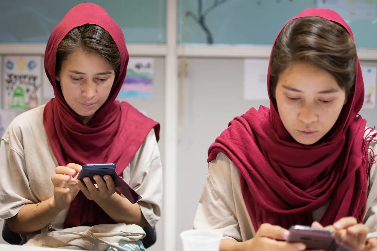 Maliheh and Nahid on phones