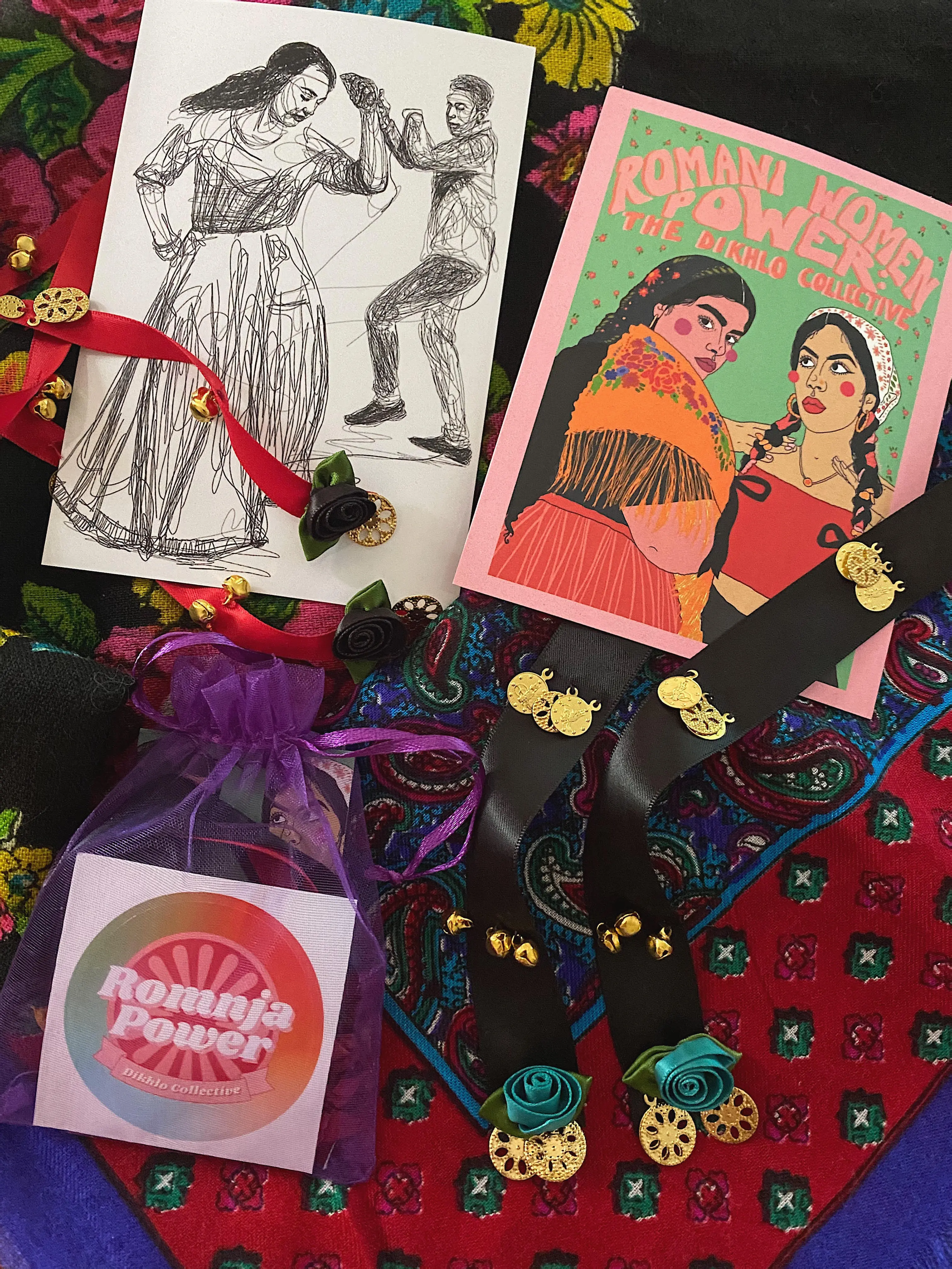 Items including decorated ribbons, cards, and a colorful dikhlo scarf.
