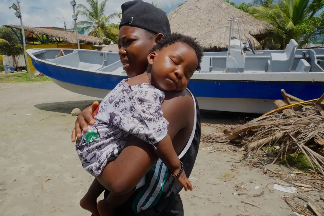 Maria Joseph, 18, camps in Colombia with her 1-year-old son