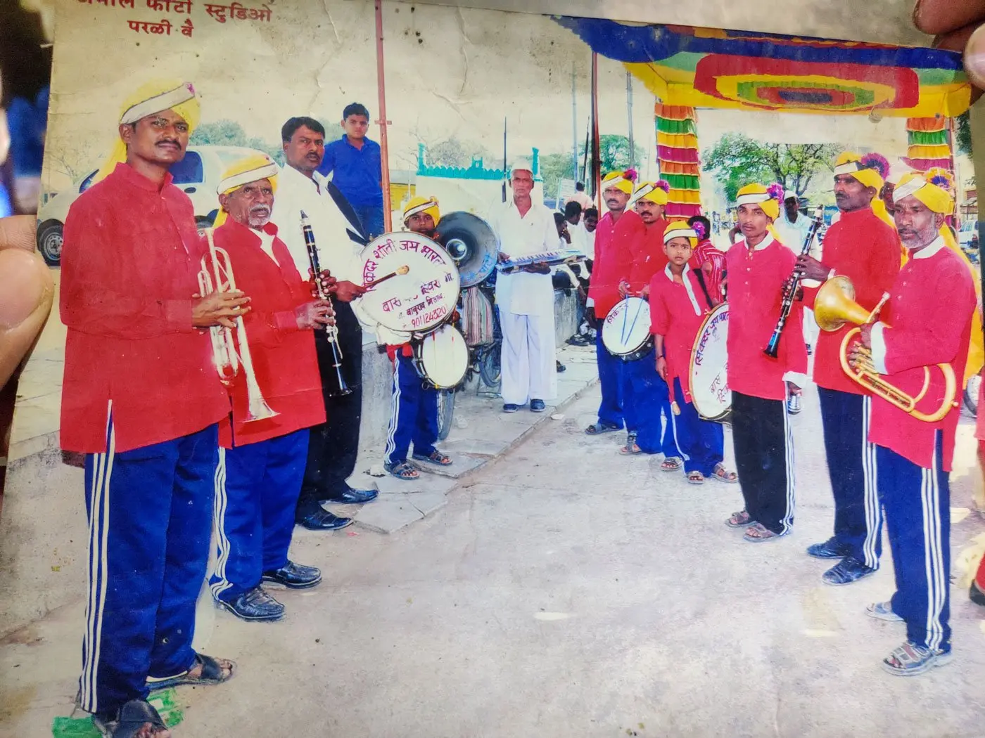 Band members in rural India holding instruments 