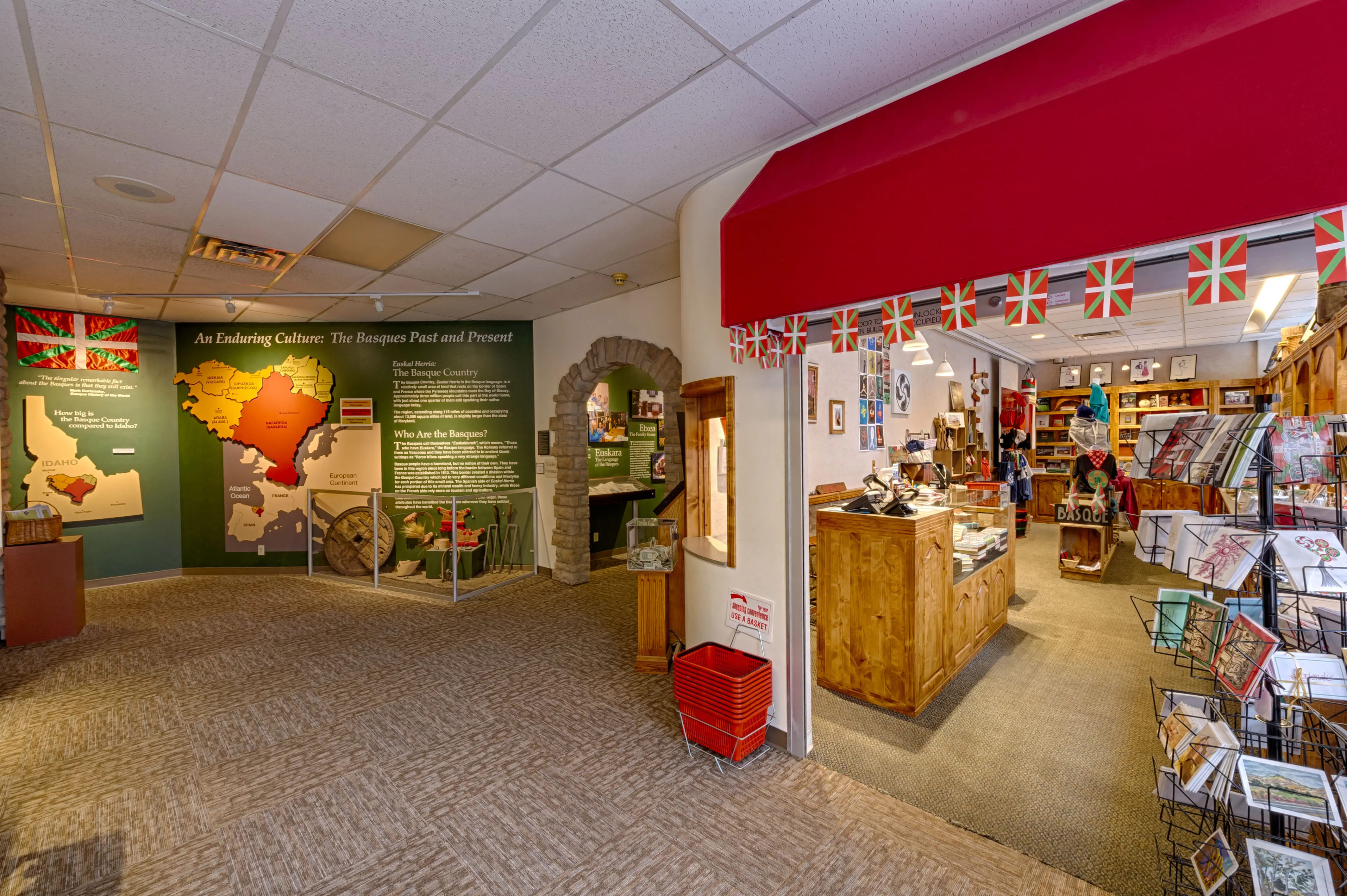 Inside of the Boise Basque Museum and Cultural Center. Pictured are an exhibit about Basque history and culture and a gift shop.