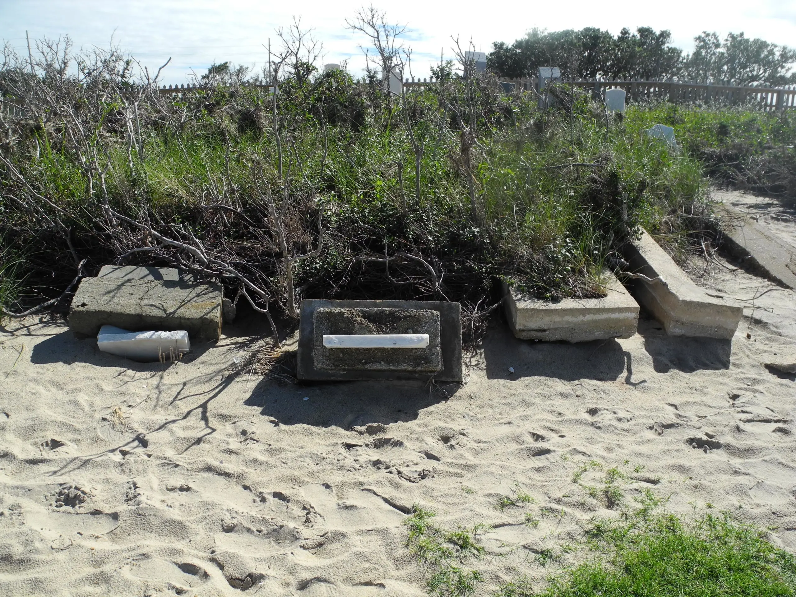 The exposed graves of Dortha and Little Bannister Midgett in September 2014