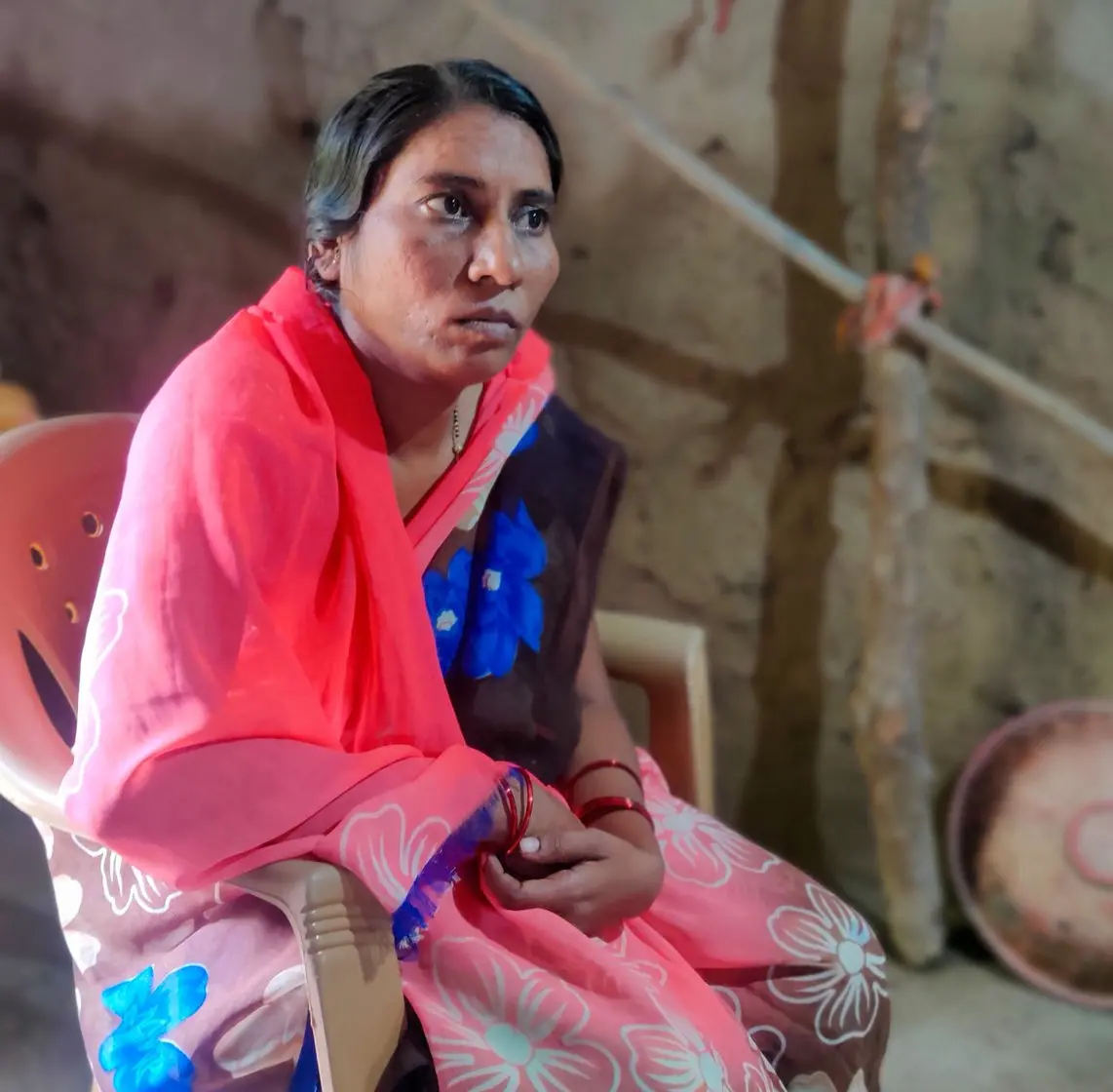 Woman sits in a chair