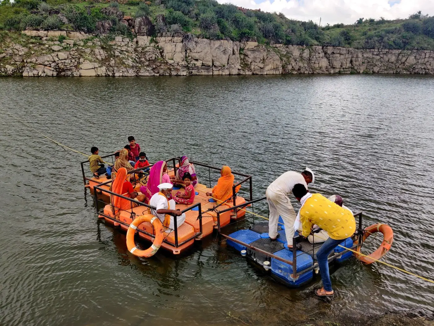 Members of the village sitting on the raft