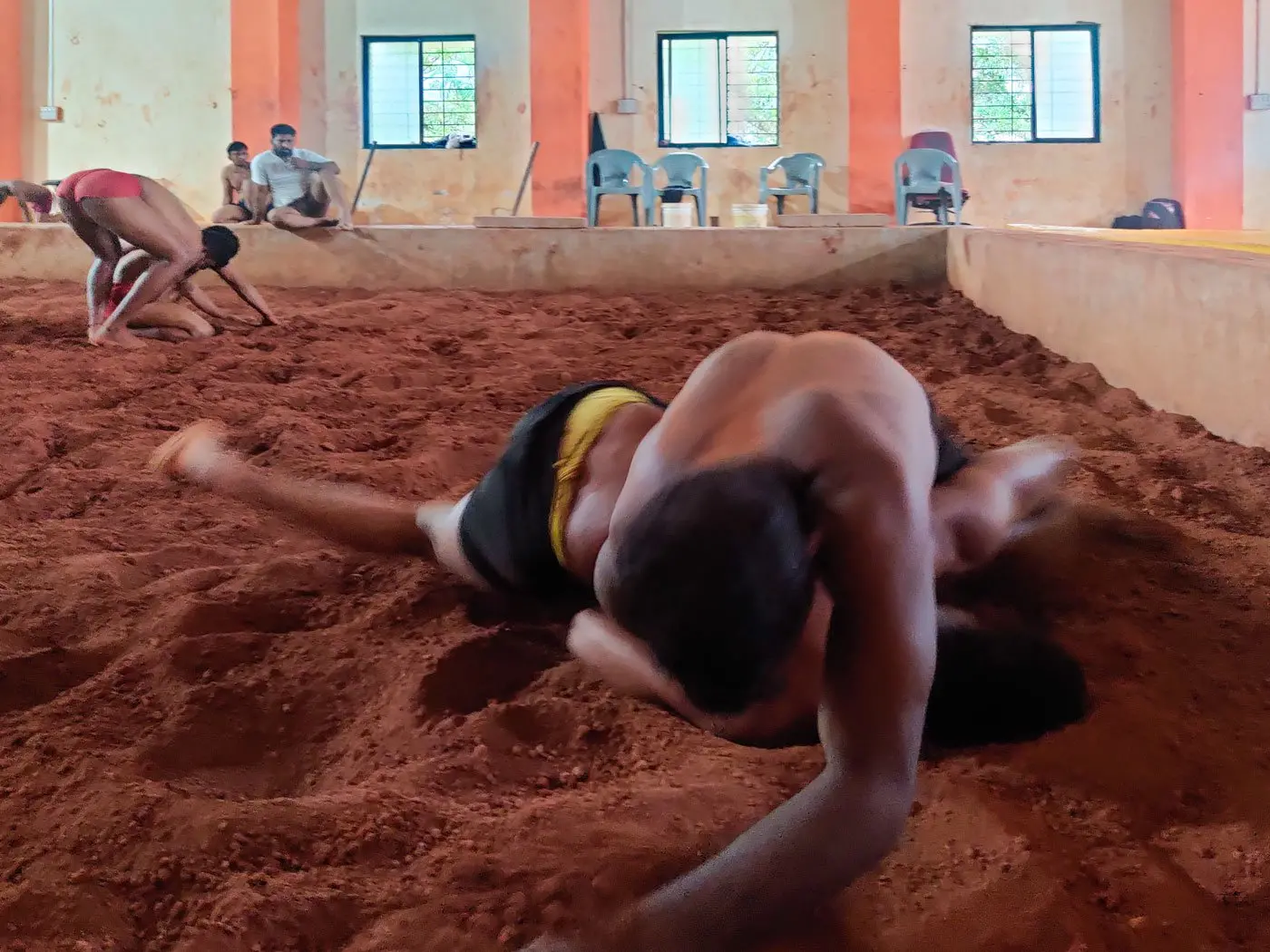 Two young men wrestle