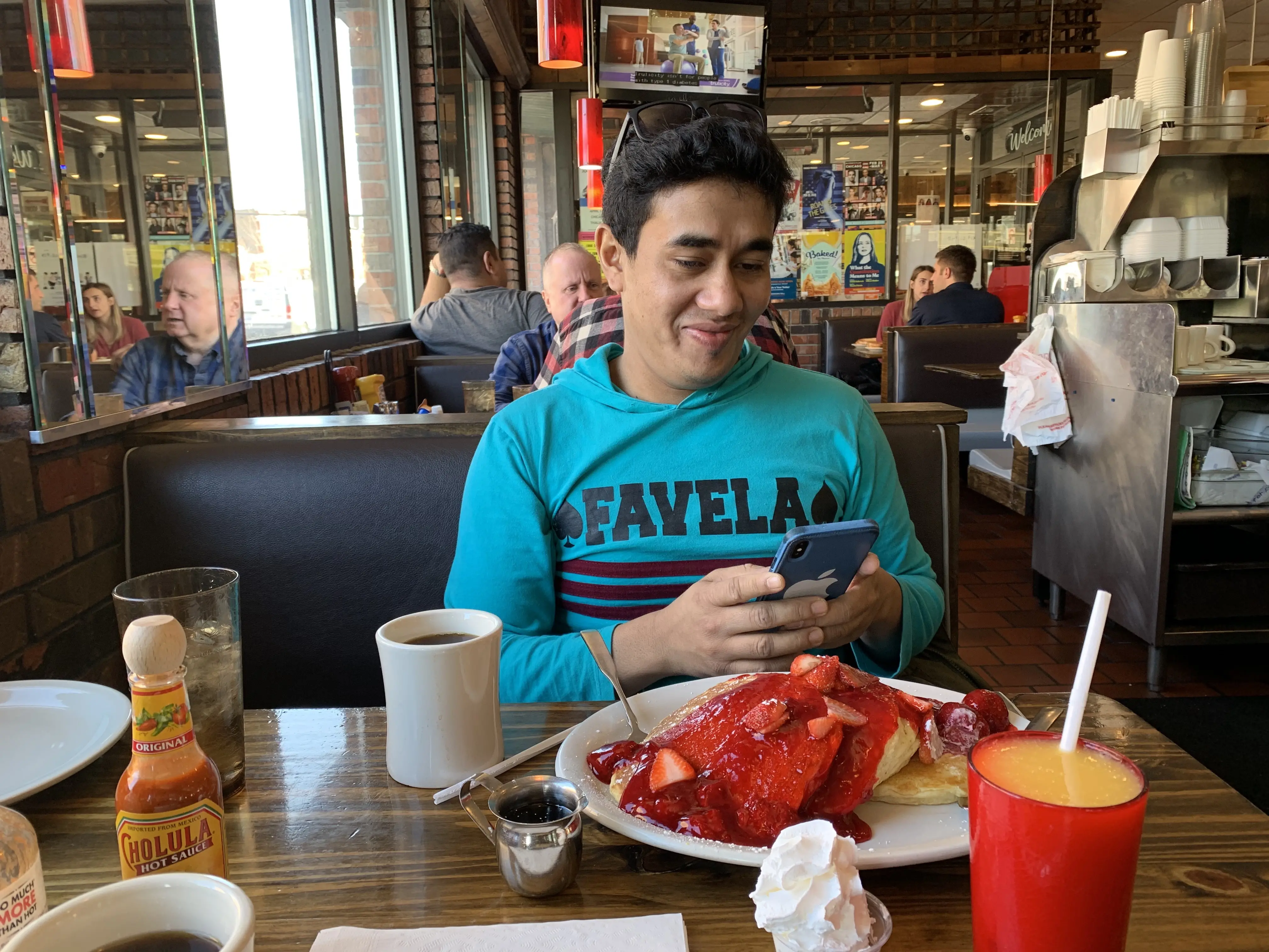 Man takes photo of breakfast at a diner in Chicago