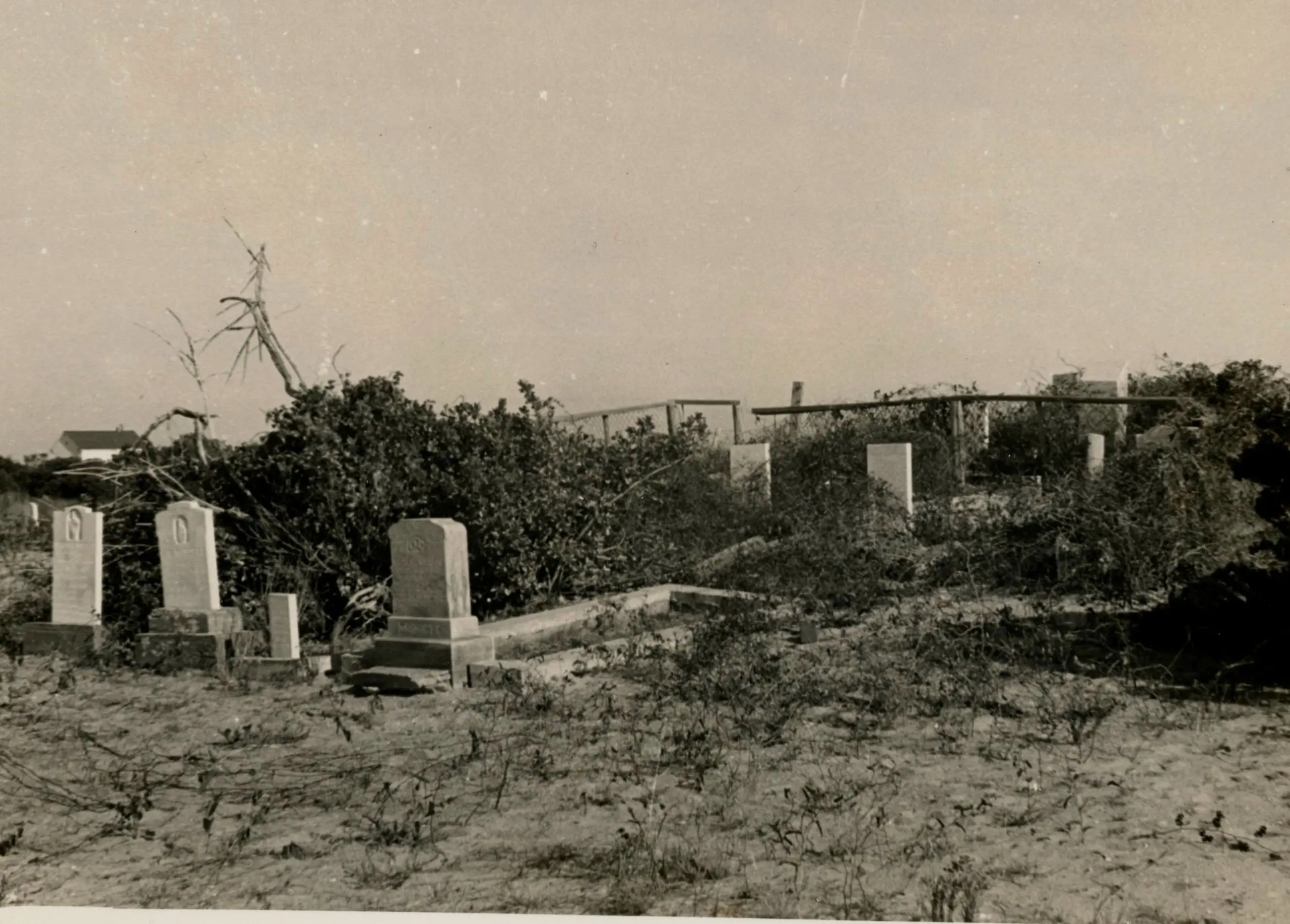 An undated photo of the graves of Dortha and Little Bannister Midgett, far left, before they were washed away.