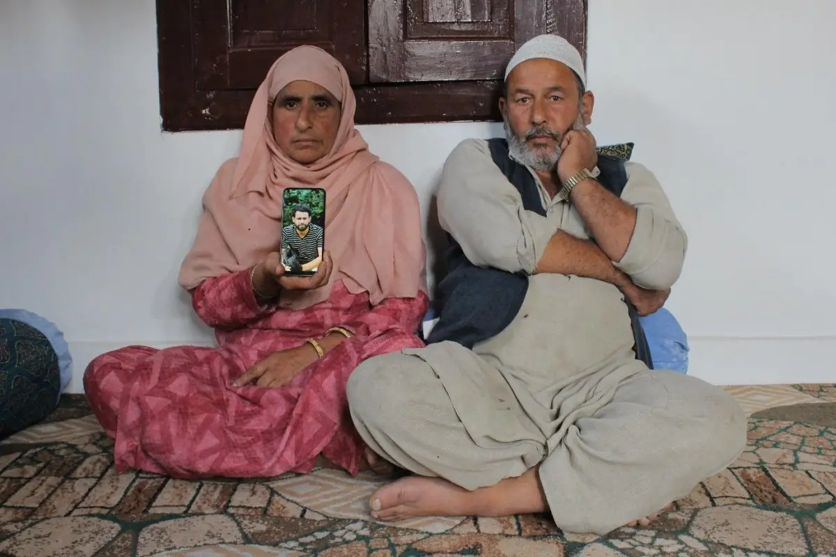 Family holds up photo of son they lost