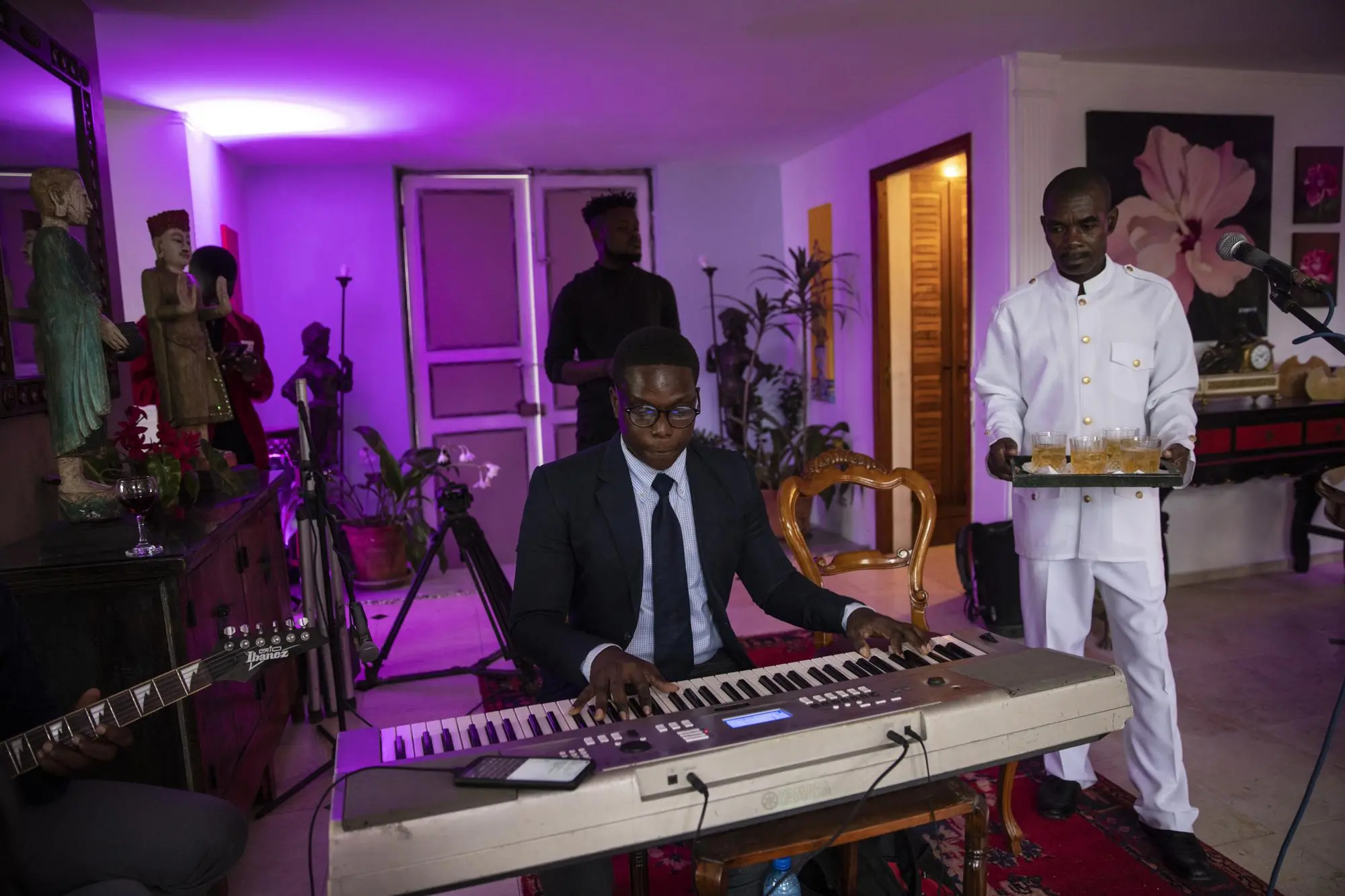 A man plays piano at birthday celebration